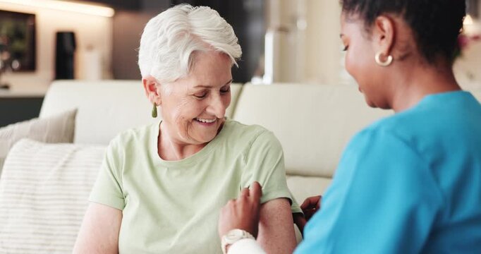 Nurse, old woman and bandage for vaccine in home, healthcare and medical wellness. Caregiver, plaster and happy elderly patient in living room for virus safety, protection or immunity in retirement