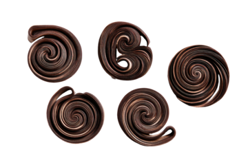 Five abstract chocolate swirls on black background