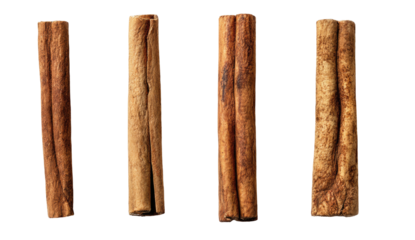 Four cinnamon sticks on a black background