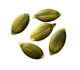 Five green pumpkin seeds scattered on a black background