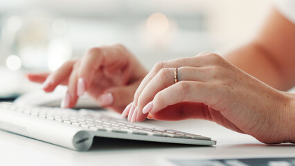 Woman, hands and typing with computer in office for public relations, press release or brand management. Bokeh, female person or search with keyboard in workplace for PR statement, email or feedback.