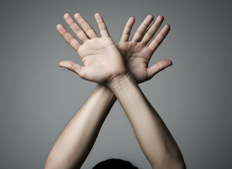 emergency SOS signal formed with human hands waving above head, clear body-language reaction