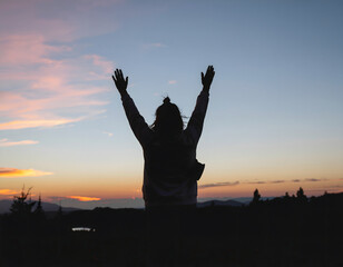 person waving both arms overhead in the universal distress gesture, standing alone