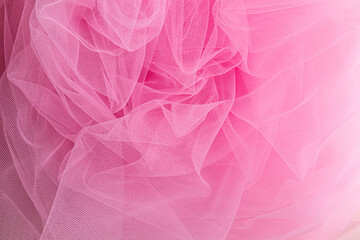 crumpled transparent fabric in pink. elegant folds of the veil in a delicate veil pink . top view....