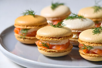 Gold Macaron Appetizers Stuffed with Smoked Salmon, Cream Cheese, Dill Herb, and Savory Filling​