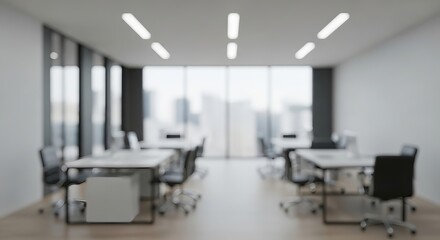 Office space with blurred desks and chairs, natural light background, showing a modern workplace.