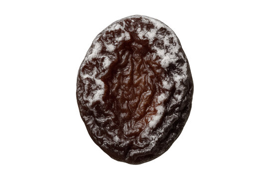 A single dried prune with crystallized sugar on its dark, wrinkled, and glossy surface, captured in a detailed macro studio shot showing its rich, dehydrated texture