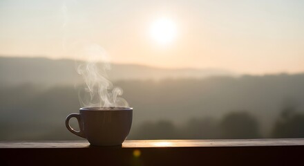 Morning coffee with steam against a hazy sunrise landscape view