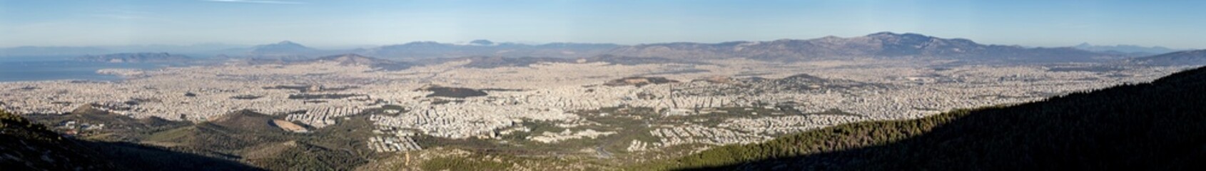 Wide panoramic view over Athens from Mount Hymettus, clear winter daylight and distant coastal horizon image