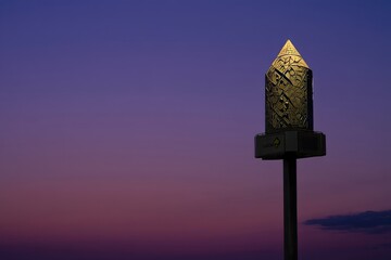 Illuminated Mosque Minaret Against Colorful Sunset Sky