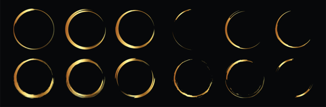 Golden hand drawn round frames. Gold circle brush strokes set. Isolated on black background