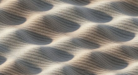 Obraz premium Closeup of undulating light brown and gray fabric with a subtle woven texture and strong shadows