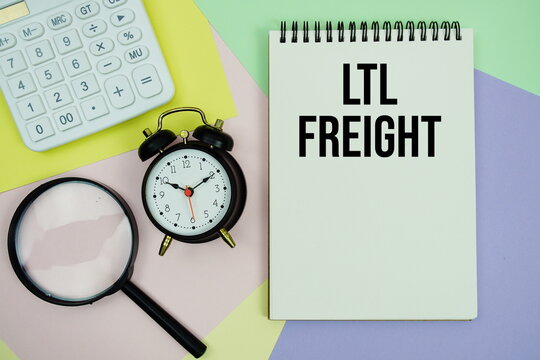 LTL Freight text with calculator, alarm clock and magnifying glass