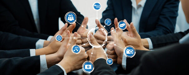 Business Team Collaborating in a Modern Workspace with Digital Media Icons Representing Networking, Communication, and Technology Innovations. Amity