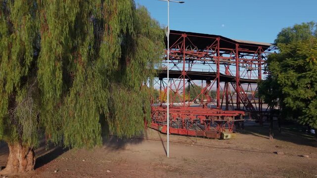 Old mining structures of Estaci&oacute;n 1 Cable Carril among trees and mountains in Chilecito, La Rioja, Argentina.