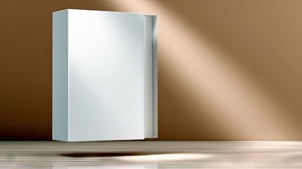 A clean, blank white box stands on a wooden floor, illuminated by dramatic diagonal light and shadow, creating a minimalist and modern aesthetic.