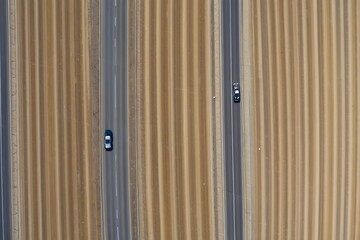 Aerial View of Farmland with Cars on Highway