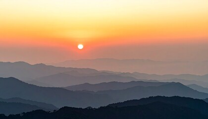 Obraz premium Sunrise Over Mountain Ranges - A Serene Landscape.