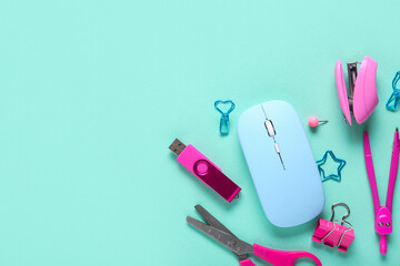 Composition with mouse, stationery and modern flash drive on turquoise background