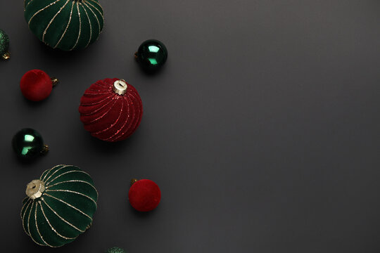Composition with different Christmas balls on black background