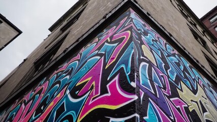 Graffiti wall with vivid colors and grunge texture, urban street art background. - Powered by Adobe