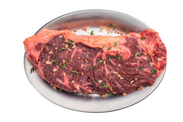 Fresh New York strip beef with coarse salt on steel dish, high quality marbled meat ready for grilling on clean white backdrop.