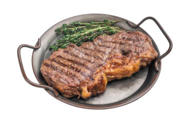 Grilled dry aged striploin steak with thyme on rustic pan over light background, juicy seared beef cooked to perfection.