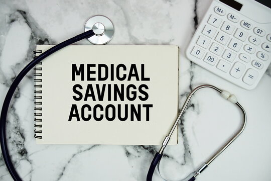 Medical Savings Account (MSA) text written on notepad with stethoscope and  calculator on marble background