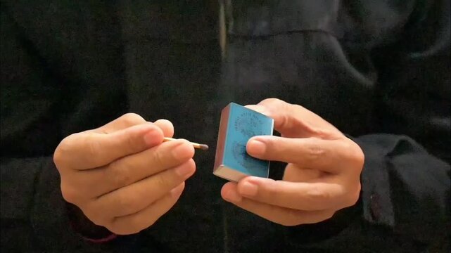 hand lighting a match, part 7