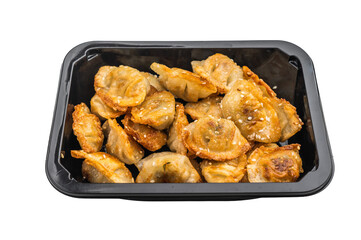 Golden pan fried dumplings jiaozi with sesame seeds, top view on light backdrop. Asian snack for restaurant design.