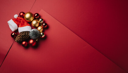 Celebrate the Holidays with Festive Decorations on Red Backdrop, Perfect for Christmas Promotions and Seasonal Greetings with a Touch of Holiday Cheer