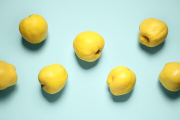 Sweet ripe quinces on blue background