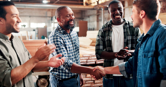 Carpentry, handshake and people in meeting in factory for woodworking, timber business and agreement. Carpenter, collaboration and workers shaking hands for lumber production, deal and partnership