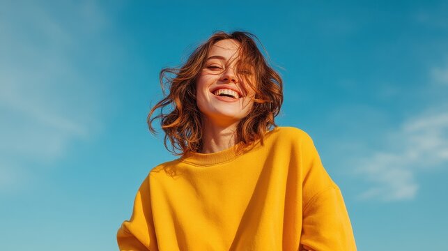 Young woman with a bright smile enjoying a sunny outdoor day.