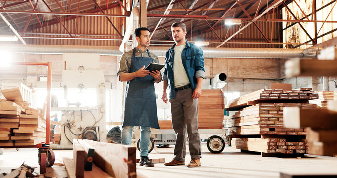 Carpentry, meeting and people on tablet in factory for planning, construction and woodworking business. Carpenter, teamwork and men on digital tech for online inventory for timber, lumber and wood - Powered by Adobe