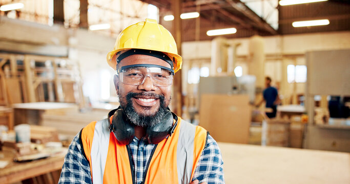 Carpentry, happy and portrait of mature man in workshop for furniture repair, building and woodworking. Carpenter, safety gear and person with pride in factory for wood, lumber and timber production