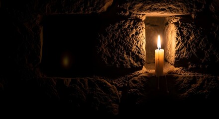 Lit Candle in Stone Niche with Warm Glow

