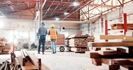 Business people, carpenter and warehouse with wood for furniture construction or production. Back view, employees or carpentry with timber, lumber or woodwork for DIY manufacturing or development