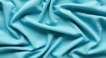 Obraz premium Aqua blue draped fabric with soft folds. Textile pattern for fashion, interior design and creative backdrop. Color of 2026 year concept.