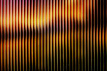 Abstract golden amber vertical lines background with grainy noise texture, dark retro futuristic gradient pattern, warm fire stripe design for digital wallpaper
