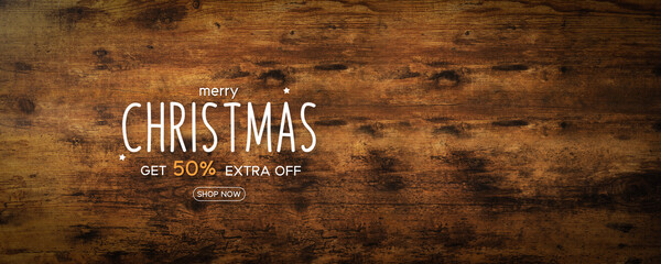 Merry Christmas on rustic wooden background with discount price tag. Christmas sale promotion. Special discount 50%. For holiday shopping promotion.