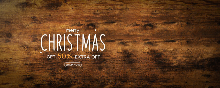 Merry Christmas on rustic wooden background with discount price tag. Christmas sale promotion. Special discount 50%. For holiday shopping promotion.