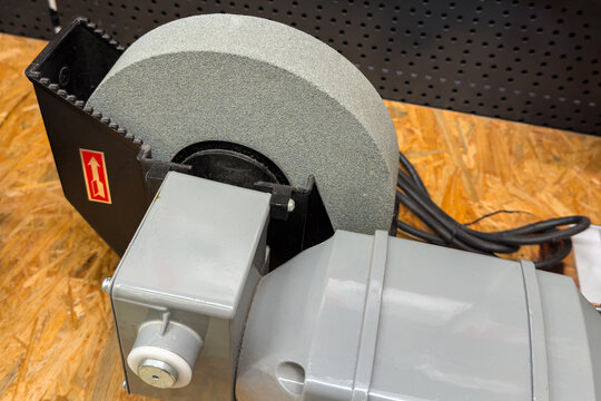 Grinding tool on workshop bench during daytime