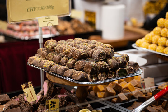 Zurich, Switzerland, November 22 2025. Variety of chocolate truffles and handmade British fudge on display trays at one of the Christmas market shops or stalls