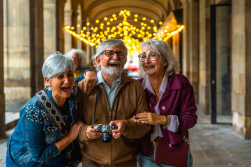Senior friends laughing and enjoying a city trip