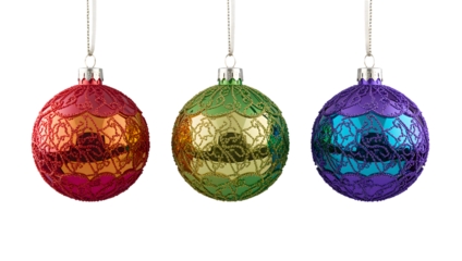 Three festive, glittering christmas ornaments with ornate patterns hanging