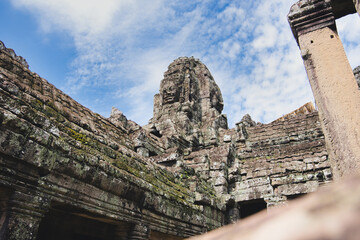 Ancient stone tower depicting a smiling face of lokeshvara at the bayon temple, part of the angkor thom complex in siem reap, cambodia, showcasing impressive khmer architecture
