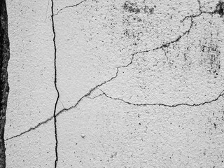Crack wall texture background broken earthquake effect, whtie grey building cement damage pattern plaster grunge black line paint surface abstract, construction rough street concrete backdrop.