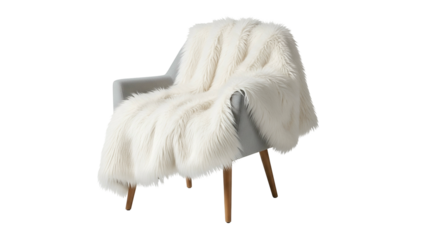 A fluffy, white faux fur throw draped over a simple gray armchair, isolated on black