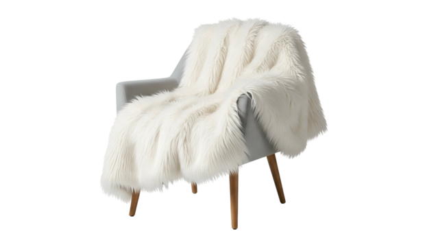 A fluffy, white faux fur throw draped over a simple gray armchair, isolated on black
